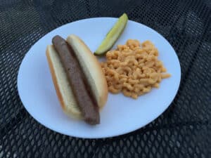 cooked venison hot dog with mac & cheese